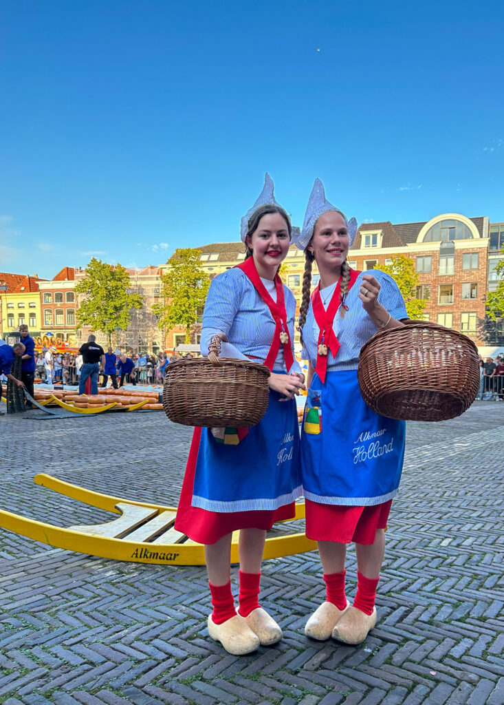 Dutch girls selling cheese.