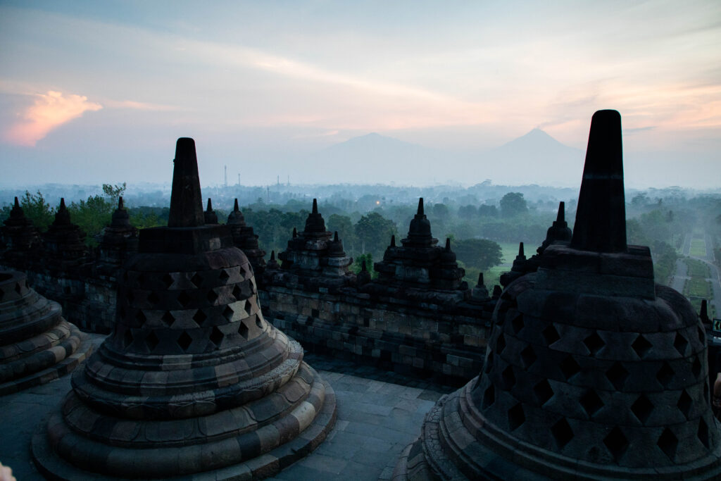 Pastel light and mist hang over Borobudur, Indonesia.