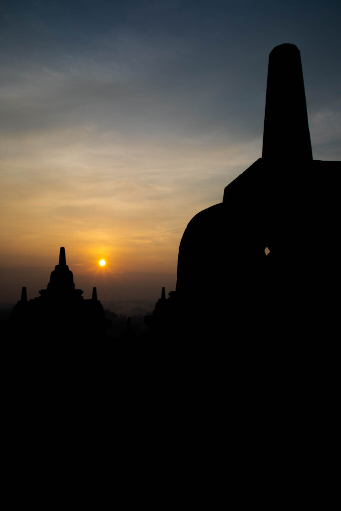 The sun rises over Borobudur, Indonesia.