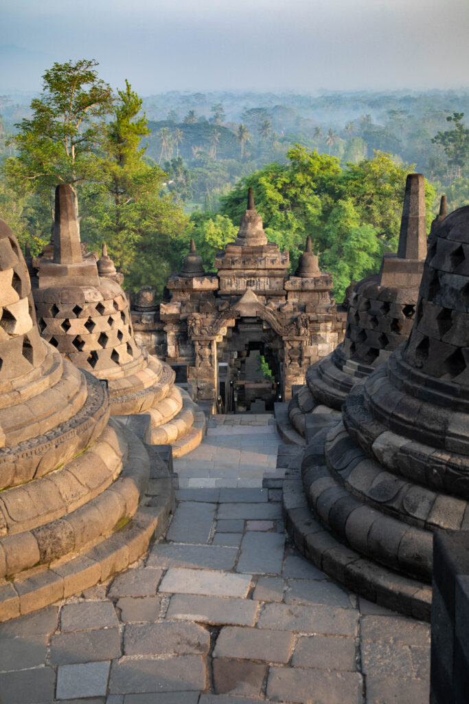 Stupas and stone gate at Borobudur, Java.
