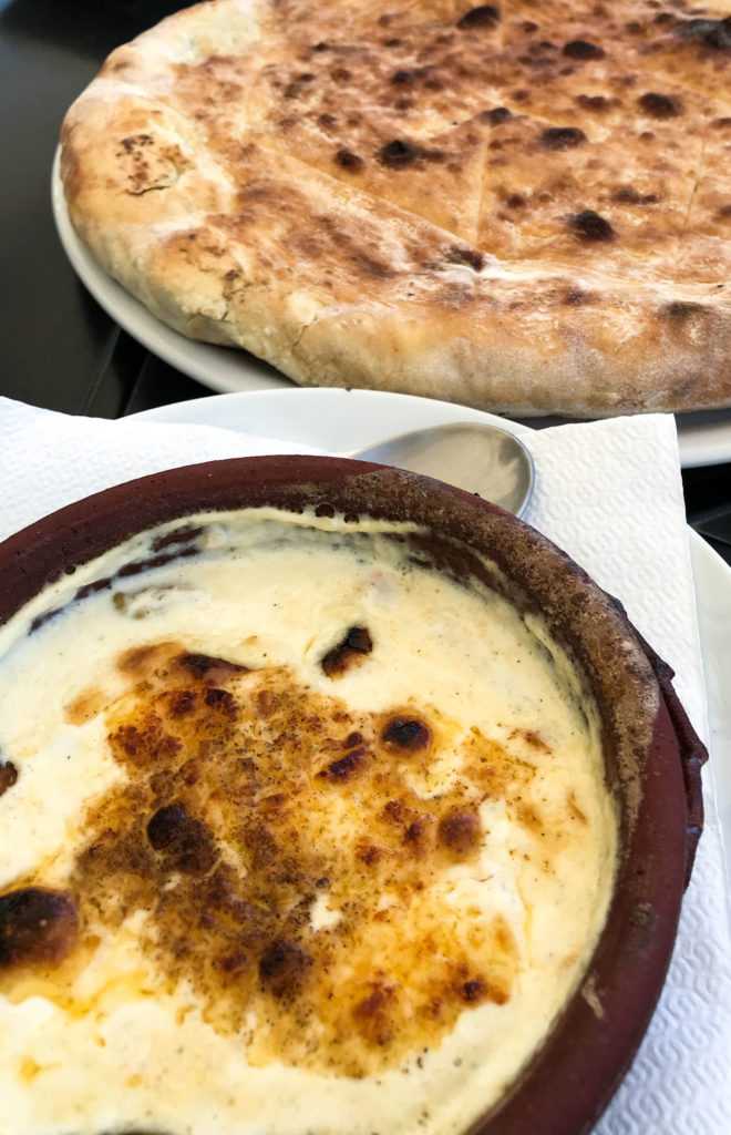 Hot cheese served with traditional bread in Kosovo.