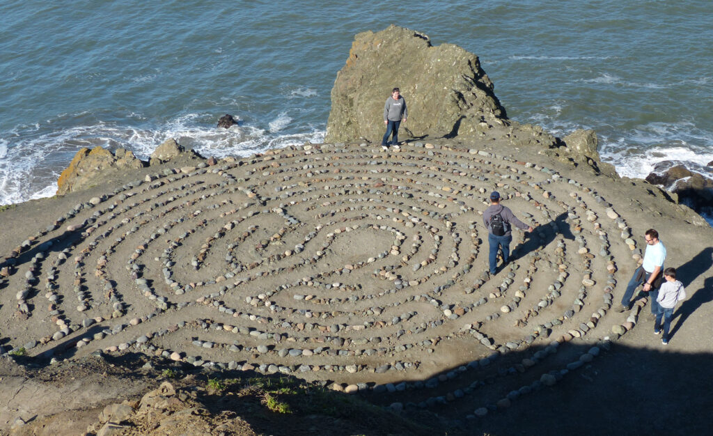 Young man wearing his best daypack while walking the Labyrinth at Lands End in San Francisco.