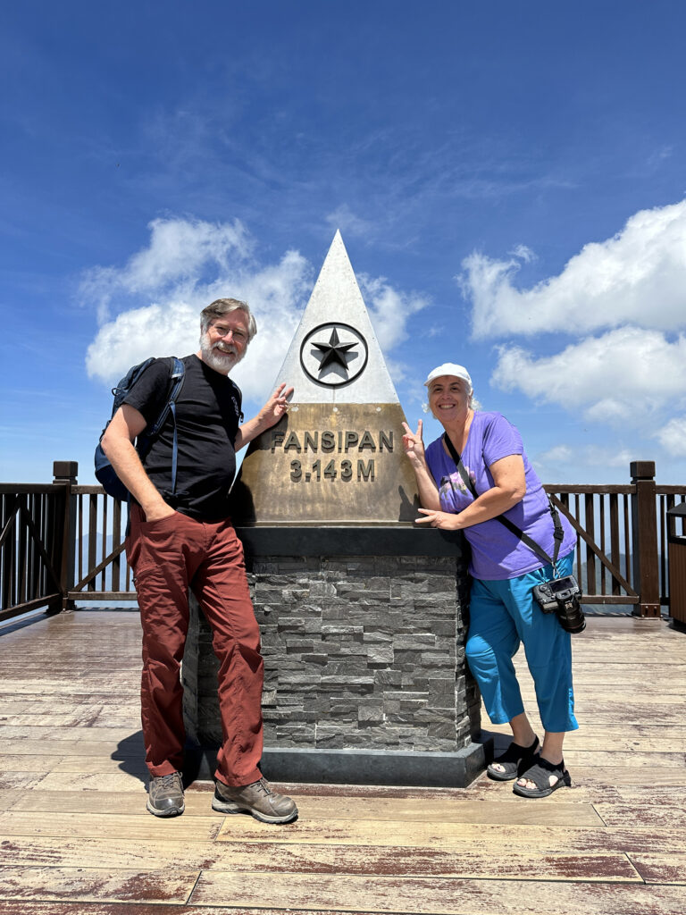 Jim and Corinne at the peak of Fansipan, Vietnam.
