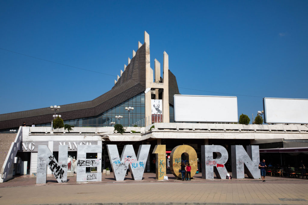 The famous and much graffitied Newborn statue in Pristina, Kosovo.