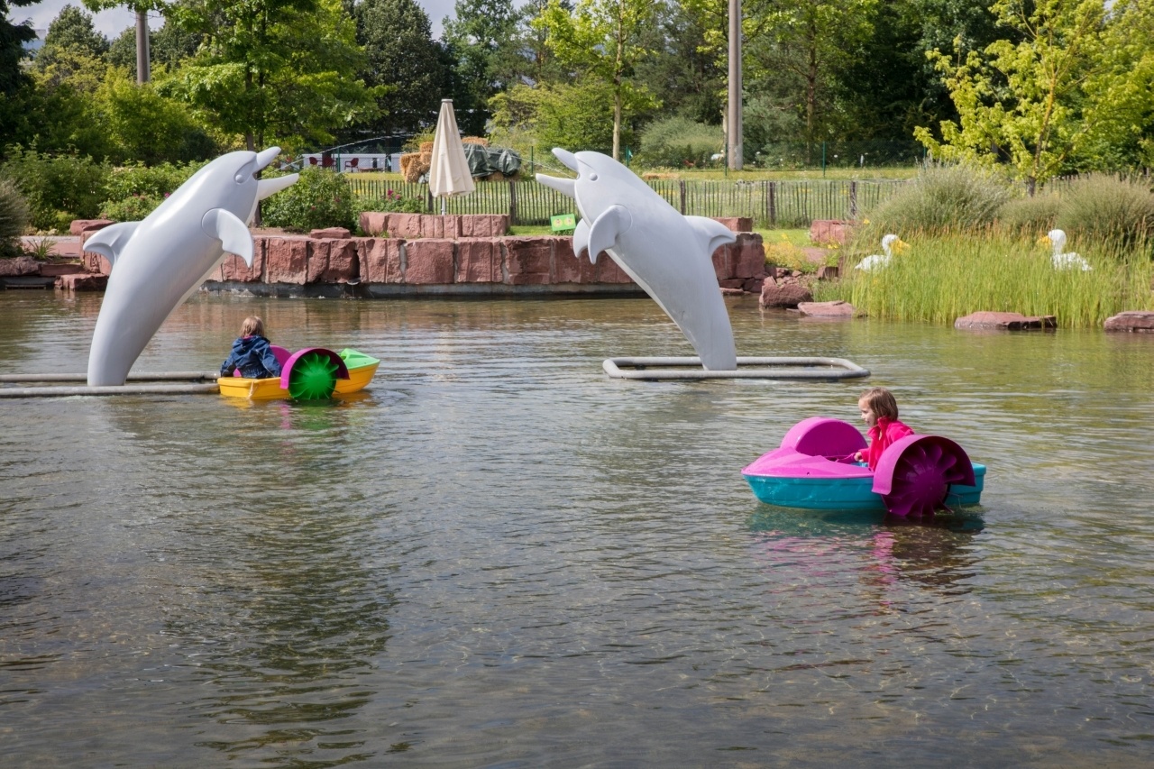 The lake has small boats for the kids to propel on their own.