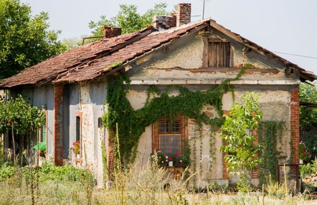 A Serbian house next to the railroad tracks during our train travel in Eastern Europe. 