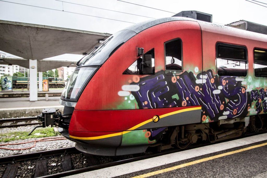 Red Train with graffiti on our Eastern Europe itinerary.