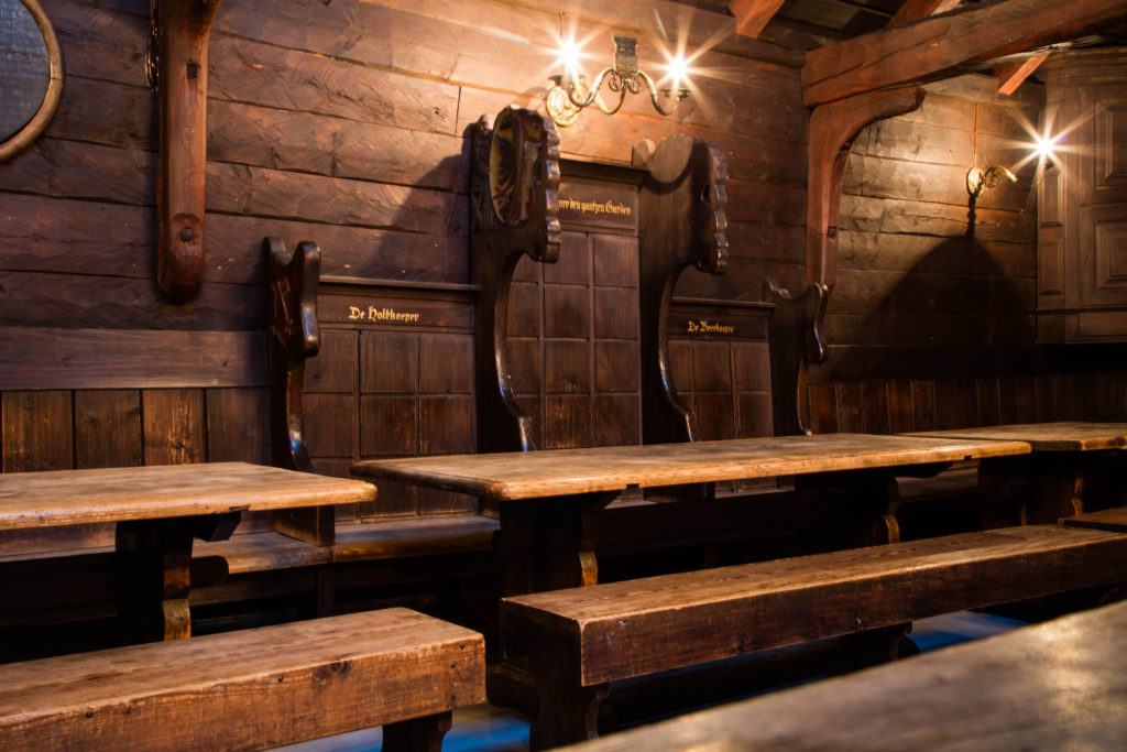 Wooden tables and benches at the Hanseatic Museum in Bergen, where meetings were once held.