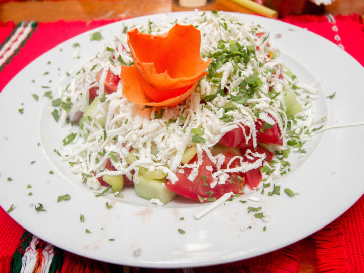 One must-try in Bulagaria is the famous Shopska Salad, sporting the three colors of the Bulgarian flag.