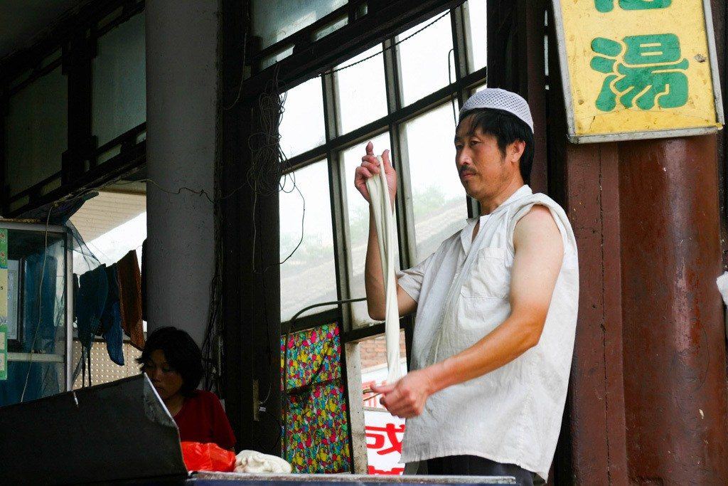 Maybe not a Xian Tourist Attraction per se, but wandering the Muslim Quarter is a must-do! This man twirling his dumpling dough mesmerized us!