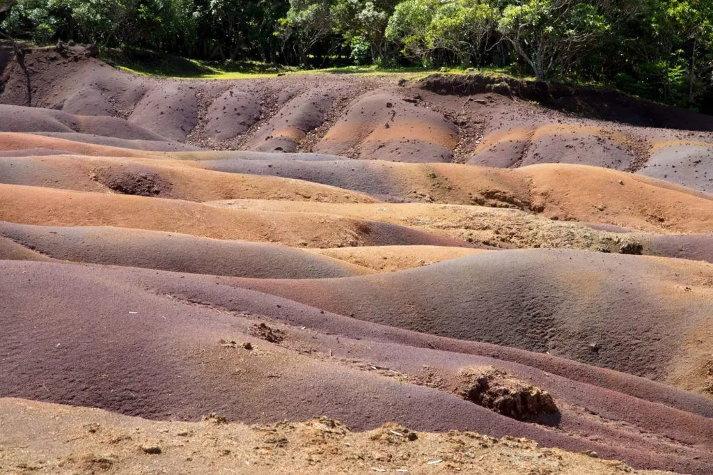 The multi-colored sands of Chamarel brightly exhibit their levels of color.