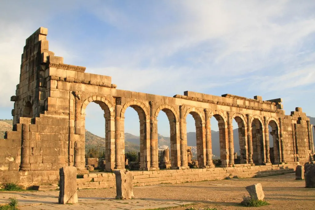 In Volubilis, Morocco, the massive row of arches from the Roman Basilica are still standing after more than 2000-years.
