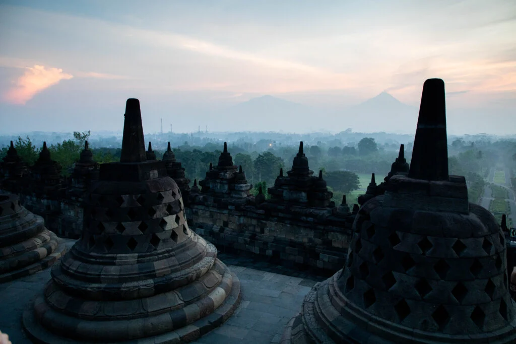 Pastel light and mist hang over Borobudur, Indonesia.