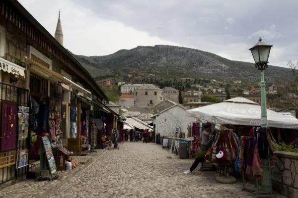 Walking street in Mostar with shopping stalls.