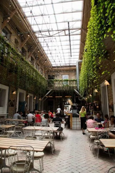 Diners sitting around and eating a meal in Budapest.