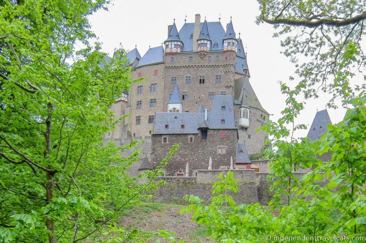 The bright green leaves of a German spring surround the gorgeous Burg Eltz castle.