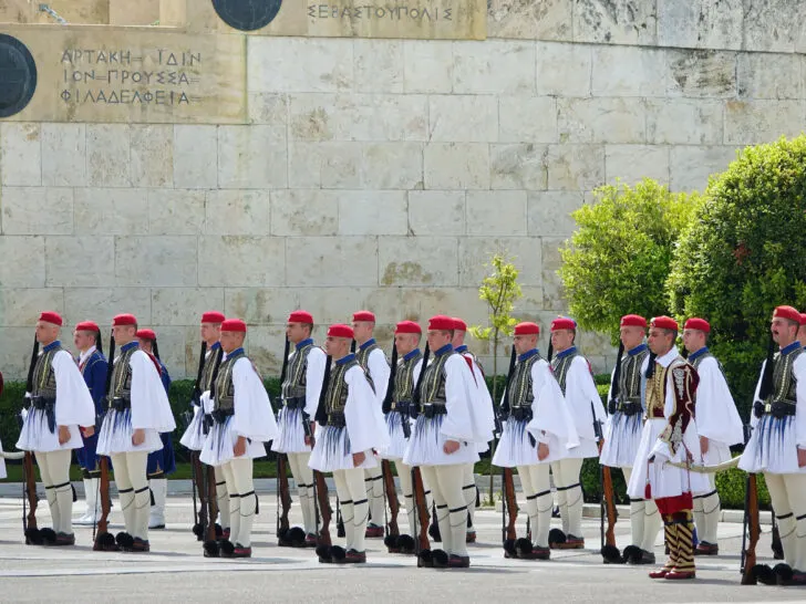 Guards, in their white ceremonial uniforms, at the Sunday morning changing of the guard ceremony in Athens Greece.