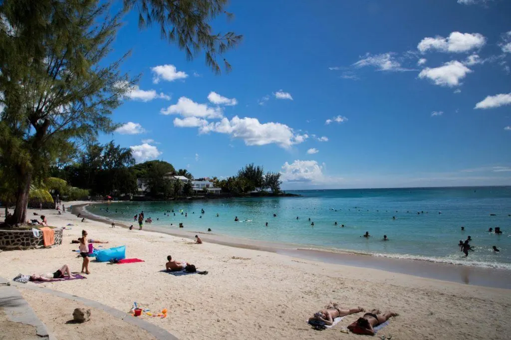 People sunbathing on the beach.