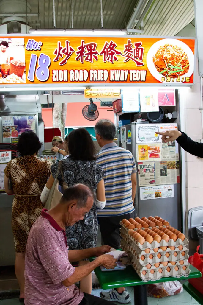 You must go to a hawker center while in Singapore.