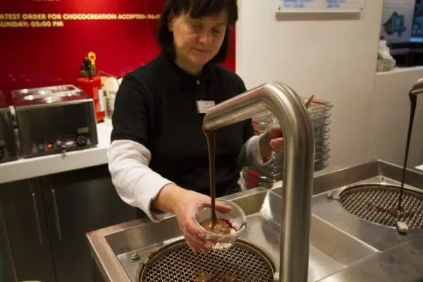 Liquid chocolate being poured into a bowl.