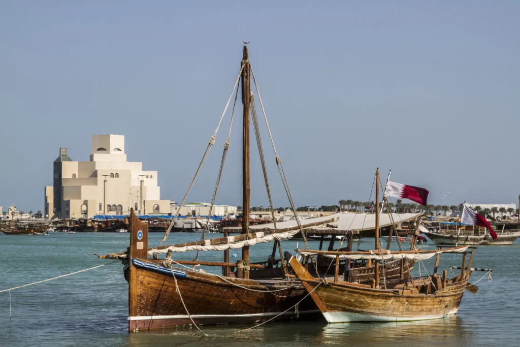 Boats docked in front of the amazing Museum of Islamic Arts in Doha, Qatar.
