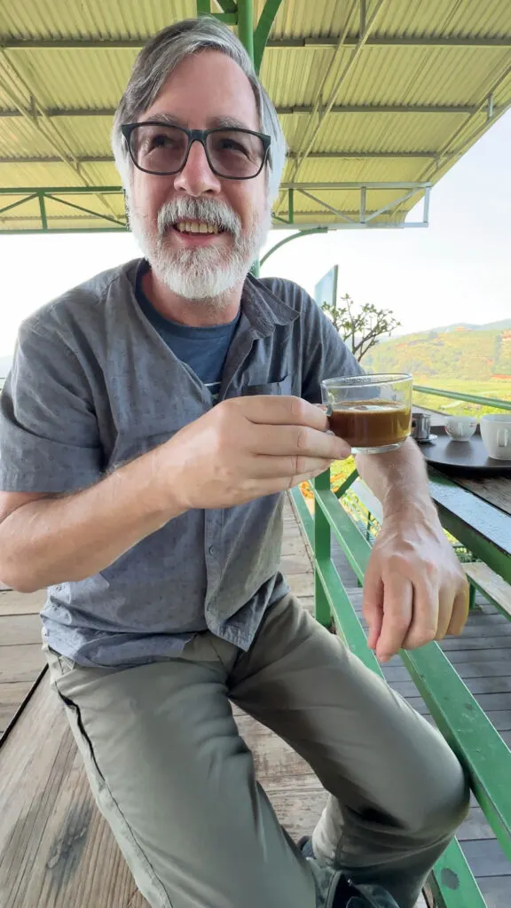 Jim trying weasel poop coffee in Vietnam.