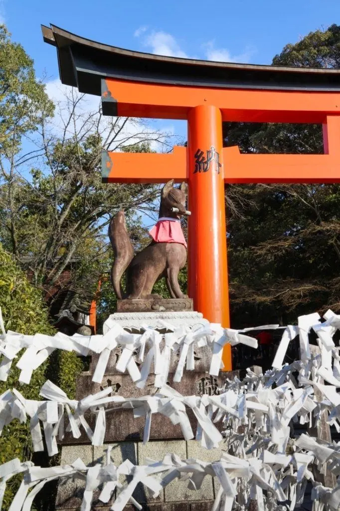 A Fox protects the entrance to Fushimi Inari Shrine in Kyoto.