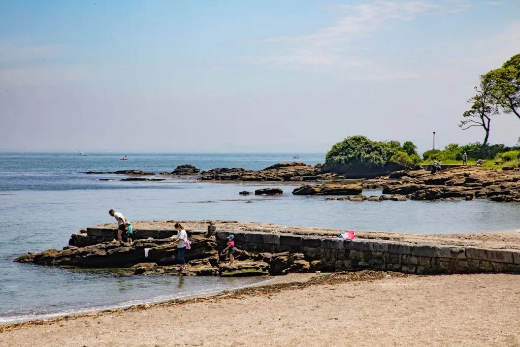Families enjoy tide-pooling during the summer, like here at Kannonzaki Park in Yokosuka.