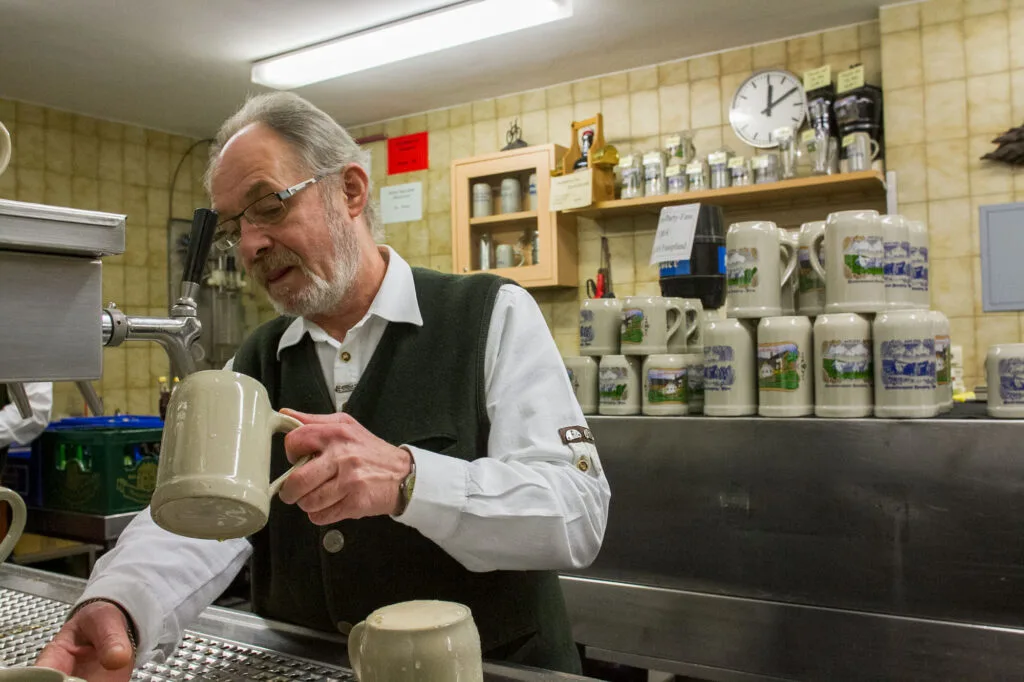 Pouring the best beer at Kreuzberg monastery and brewery.