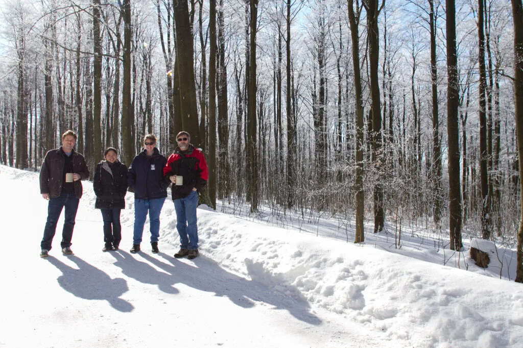 Four friends taking a beer walk.