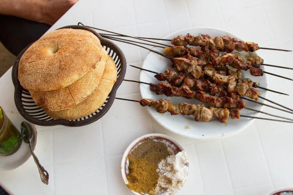 Our great lunch of fresh bread and lamb kebabs grilled in front of us.