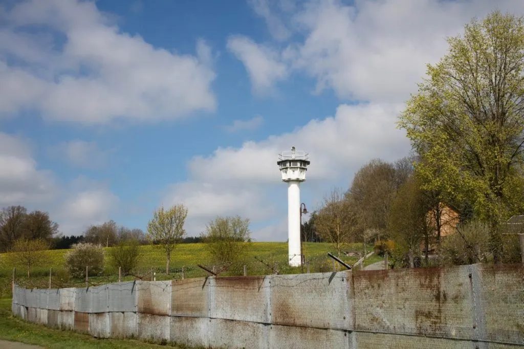 A guard tower and wall separates families that had always lived in this small town.