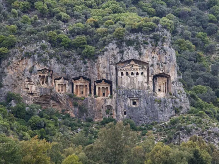 Lycian rock tombs are cut in the cliff face near Demre, Turkey.
