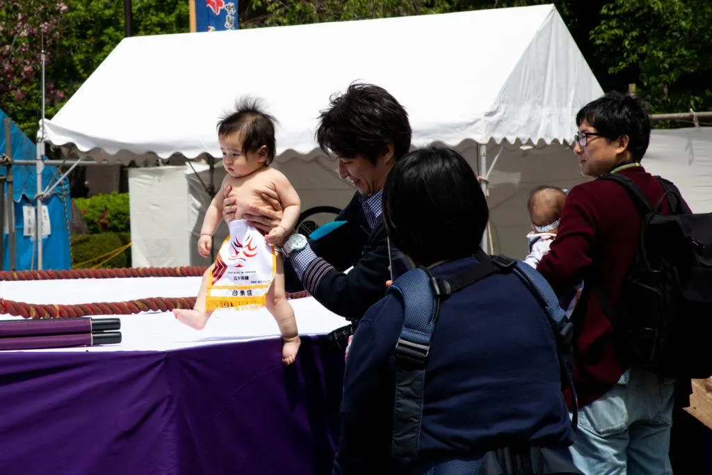 This cute little baby is ready to take on a sumo wrestler at the baby crying event in Tokyo.