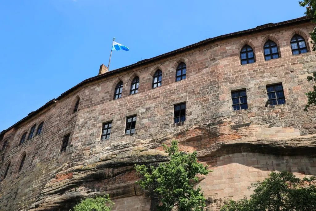 Looking up at the massive Nuremberg Castle walls from the moat below.