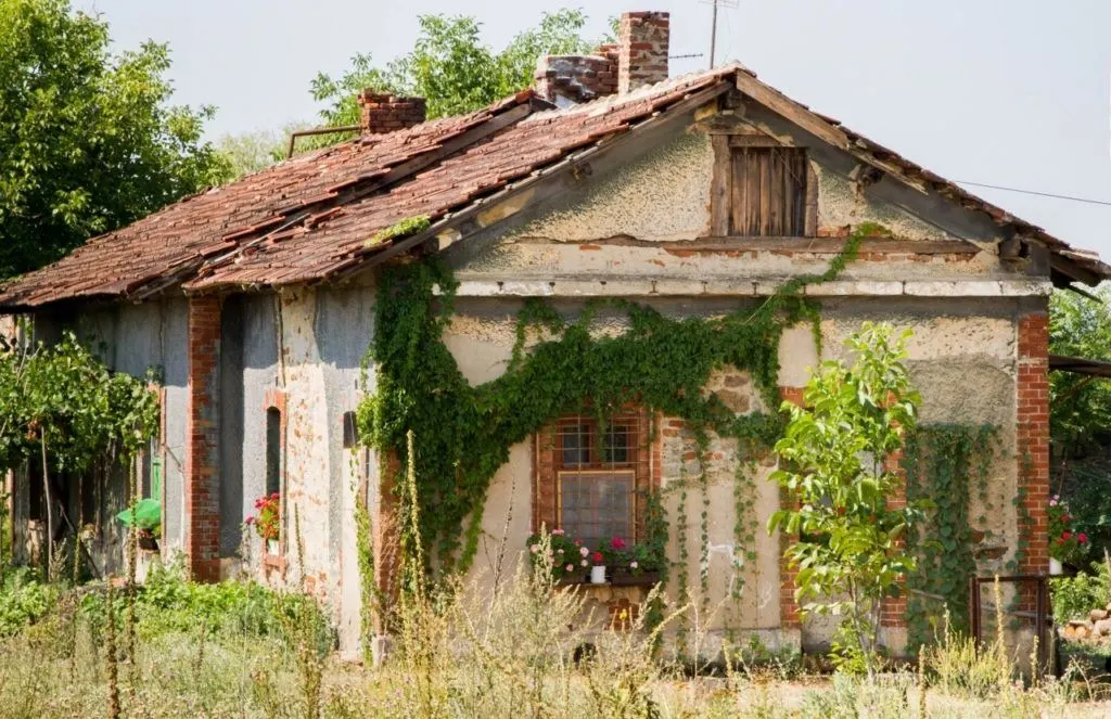 A Serbian house next to the railroad tracks during our train travel in Eastern Europe.