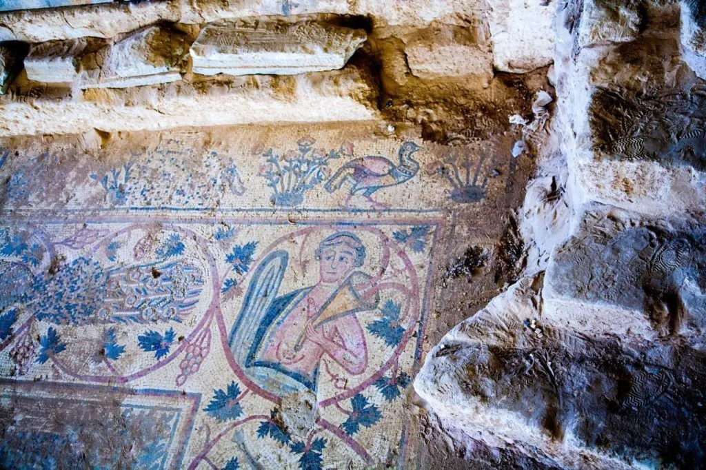 Mosaic of man and flute.