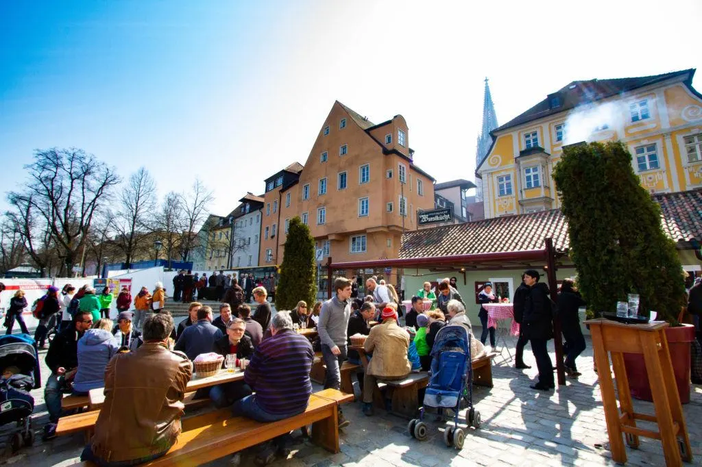 Customers enjoying the famous Wurstkuchl's sausages.