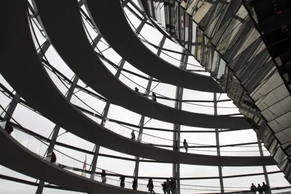 People standing and walking along circular paths around the dome.