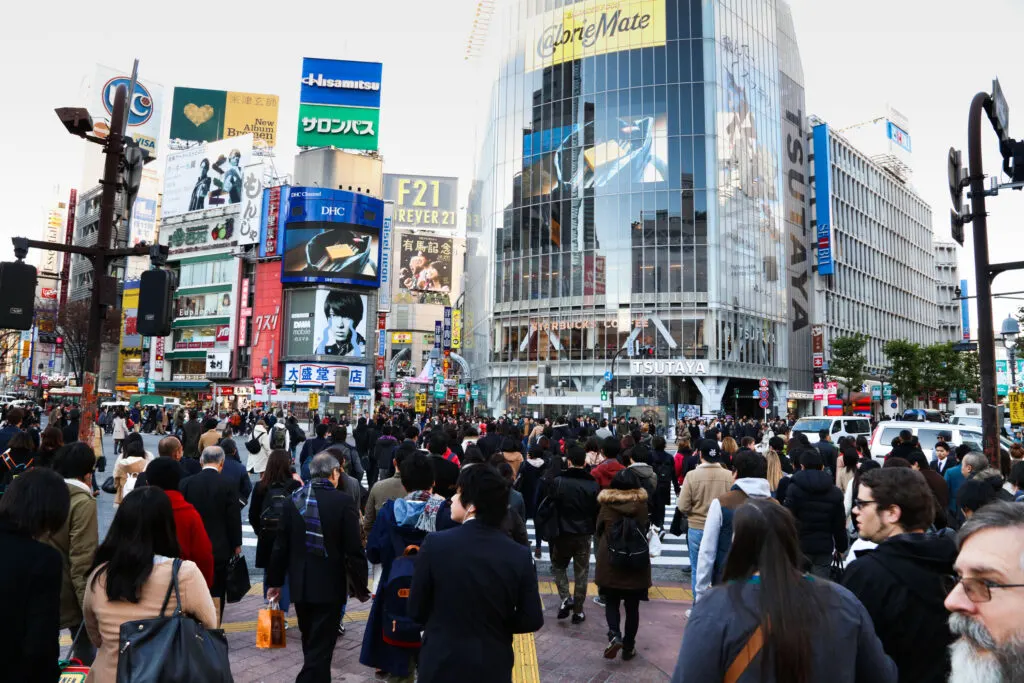 Crossing the street at the mega-intersection in Shinjuku neighborhood.
