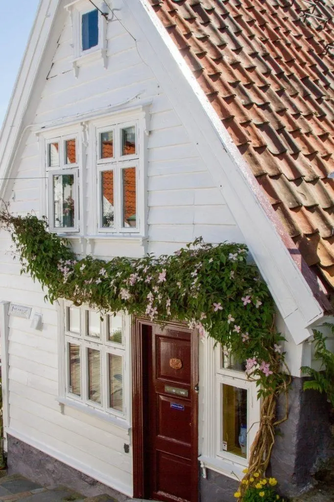 White house with flower garland.