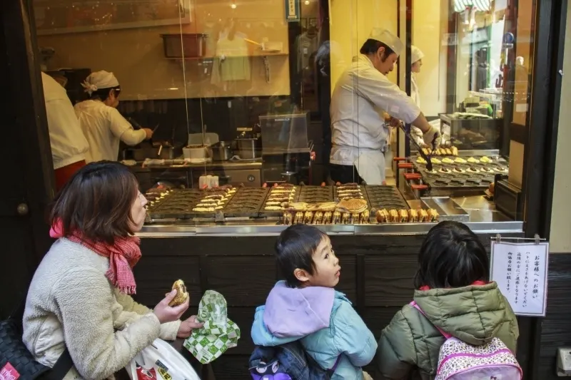 Takayaki is small fish shaped cakes with red bean paste.