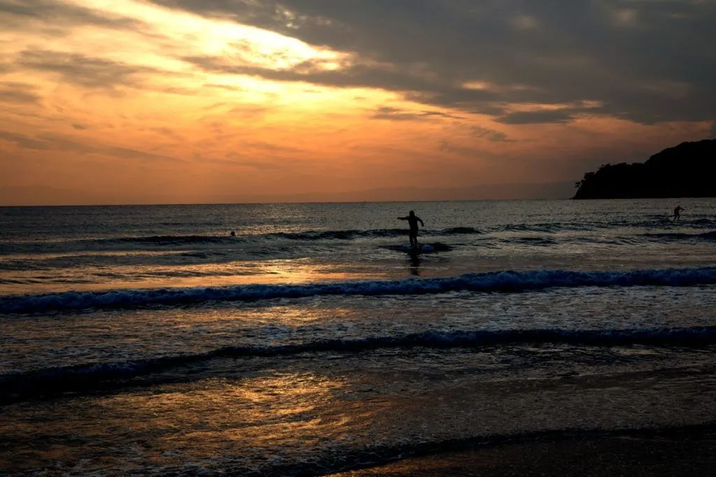 Surfers ride the waves all year long in Kamakura.