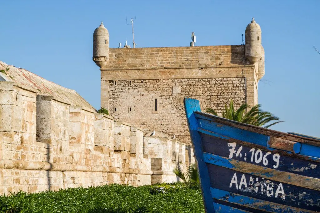 One of the top things to do in Essaouira is wandering around Skala port to see scenes like this blue boat by the city wall.