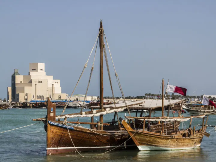 Traditional dhows wait for passengers at Doha Bay. Taking a dhow is a must-do in Qatar.