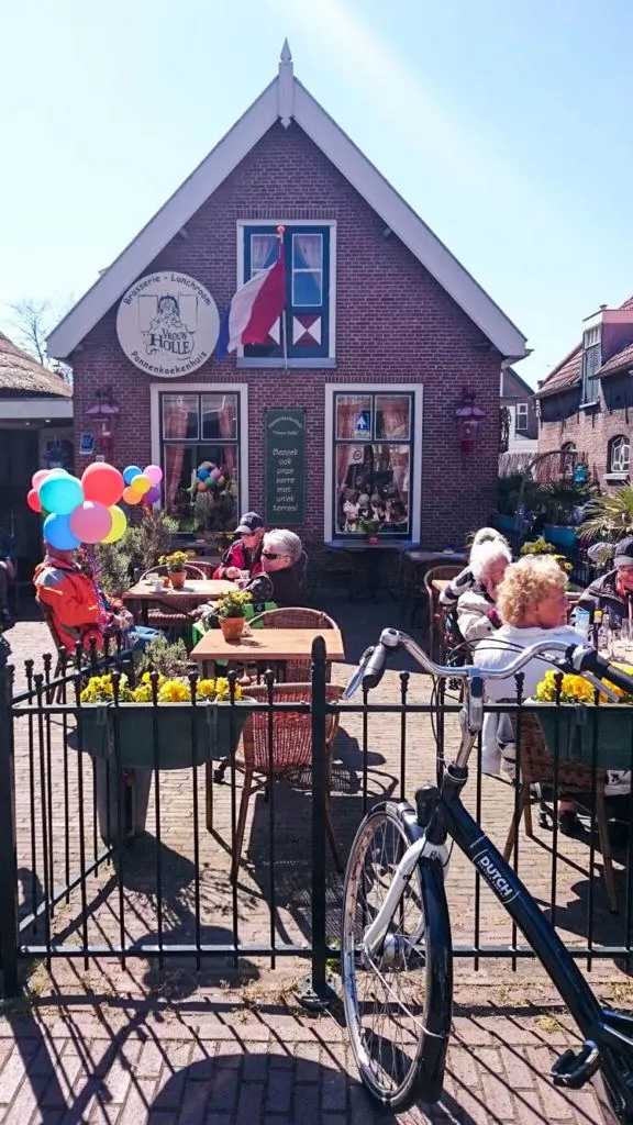 On a sunny spring day lots of folks are out bike riding and stop for a drink and pannekoeken.