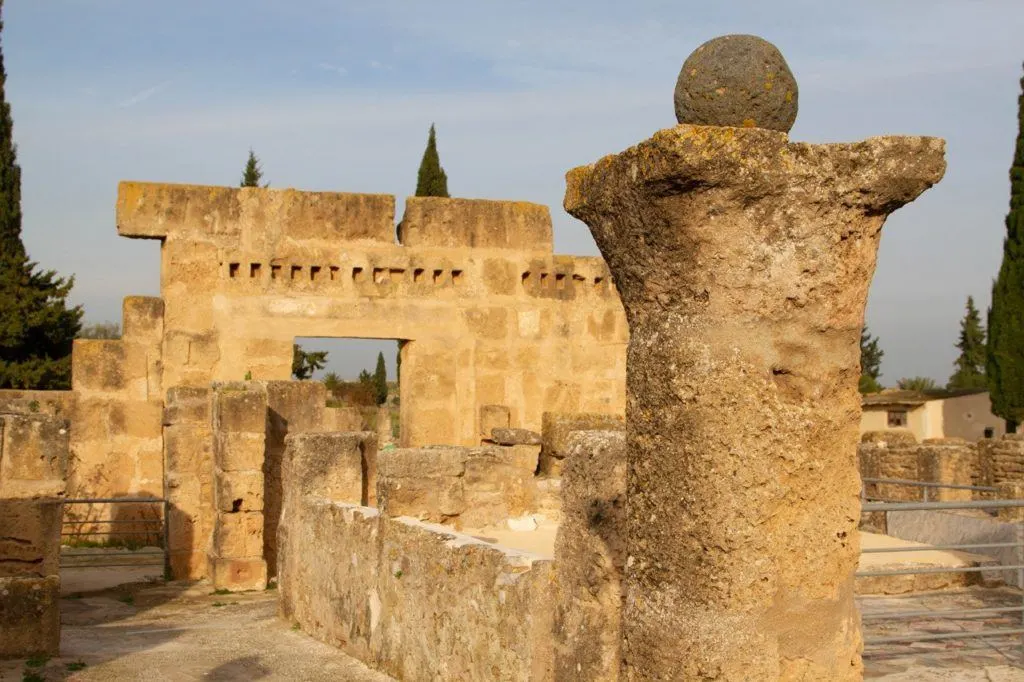 Close up of a column, ball, and arch in Utica, Tunisia.