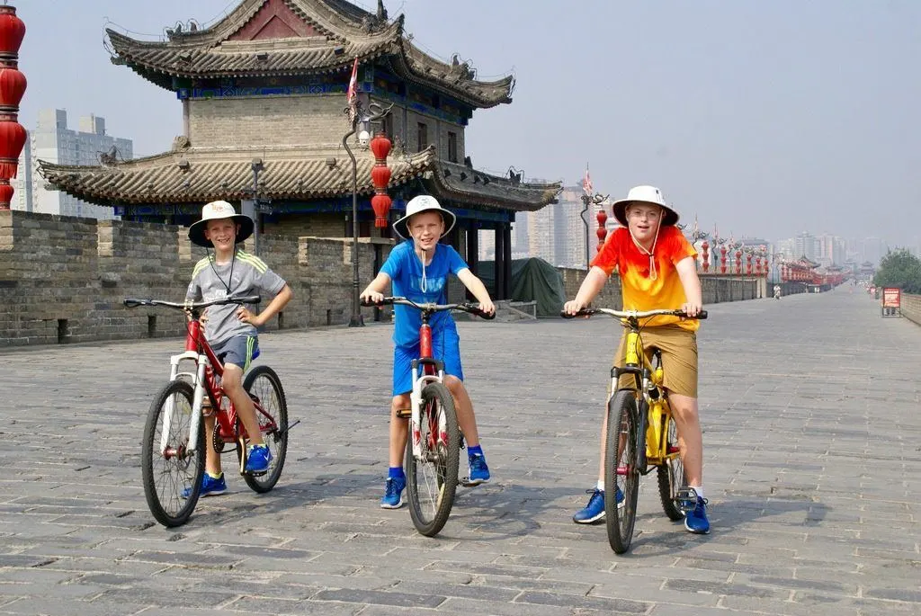 Kids love riding bikes on the walls of Xian. Make sure to put it on your Xian itinerary.